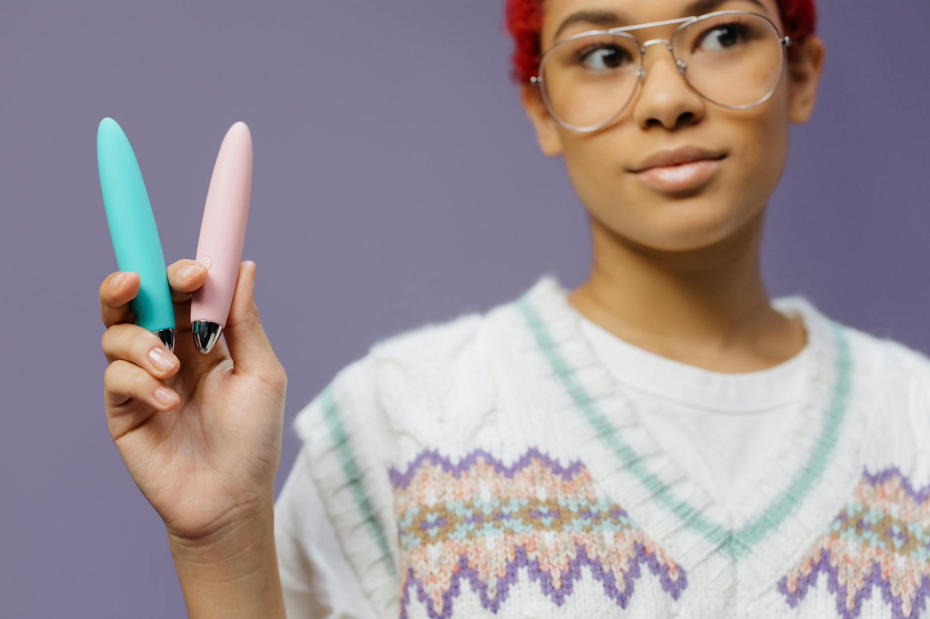 Colorful vibrators displayed, representing options for pleasure with pelvic floor awareness